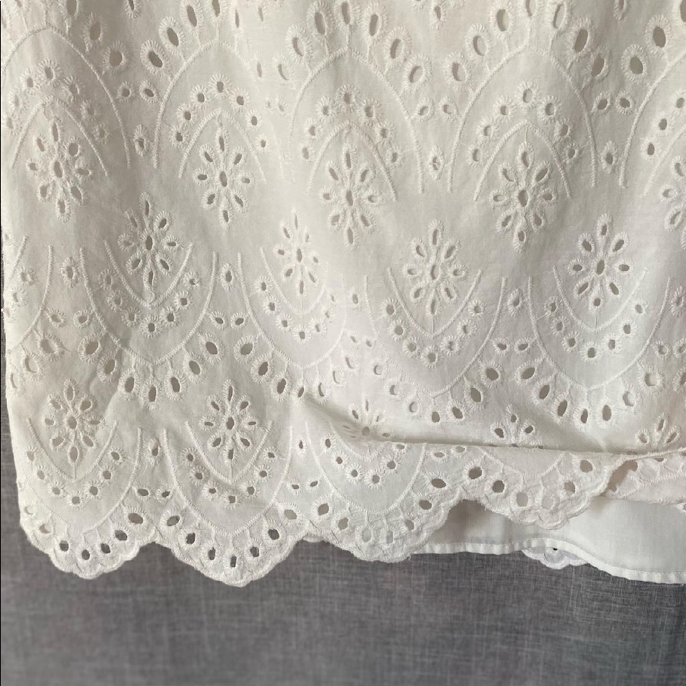 White eyelet dress with scalloped hem